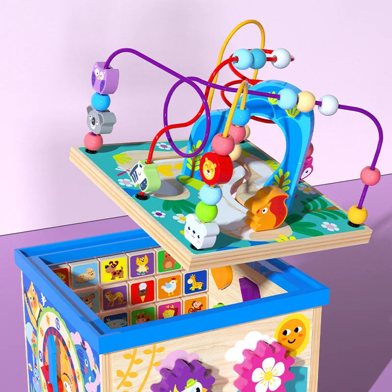 Dado motricità in legno animaletti con orologio, forme, lettere e colori